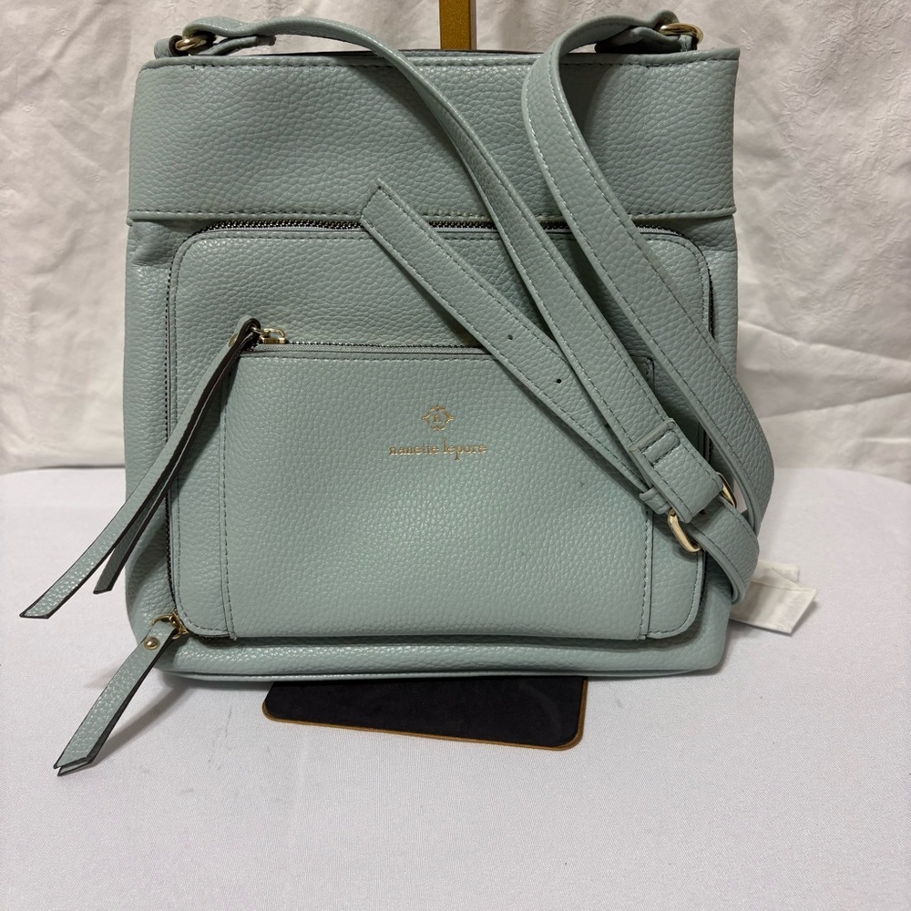 Nanette Lepore Shelia solid crossbody bag in light blue or mint green.